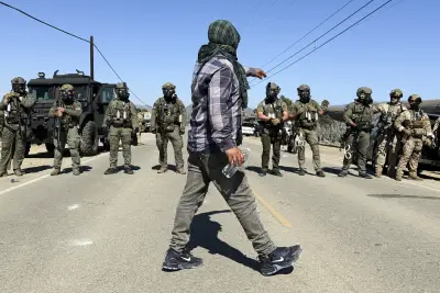 Protesters and federal agents clash during raid at Southern California farm