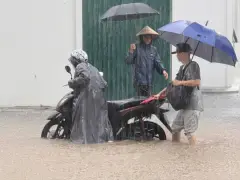 Heavy rain falls in parts of Southeast Asia after tropical storm blows into Vietnam