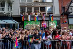 Marchers cap Pride Month with celebration and protest